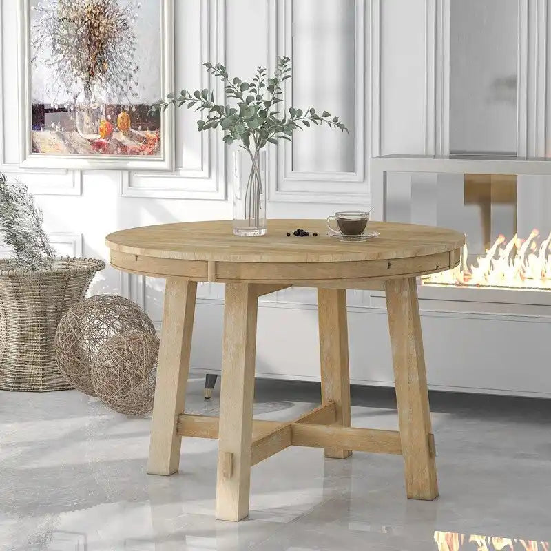 Table à manger ronde extensible avec piètement en X et rallonge intégrée